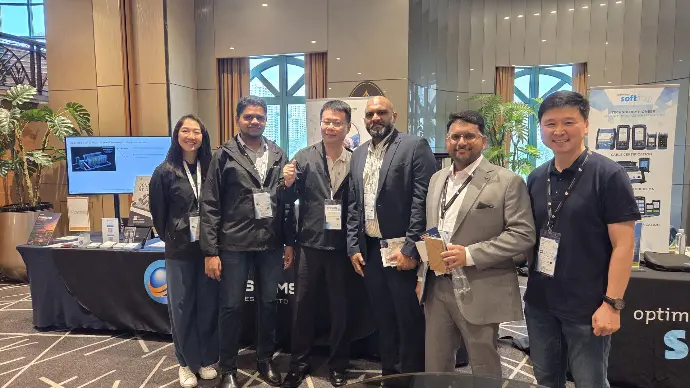 Industry Professionals Visiting the OneSystems Booth Visitors engaging with the OneSystems Technologies team at the BICSI SEA 2026 booth in Kuala Lumpur.